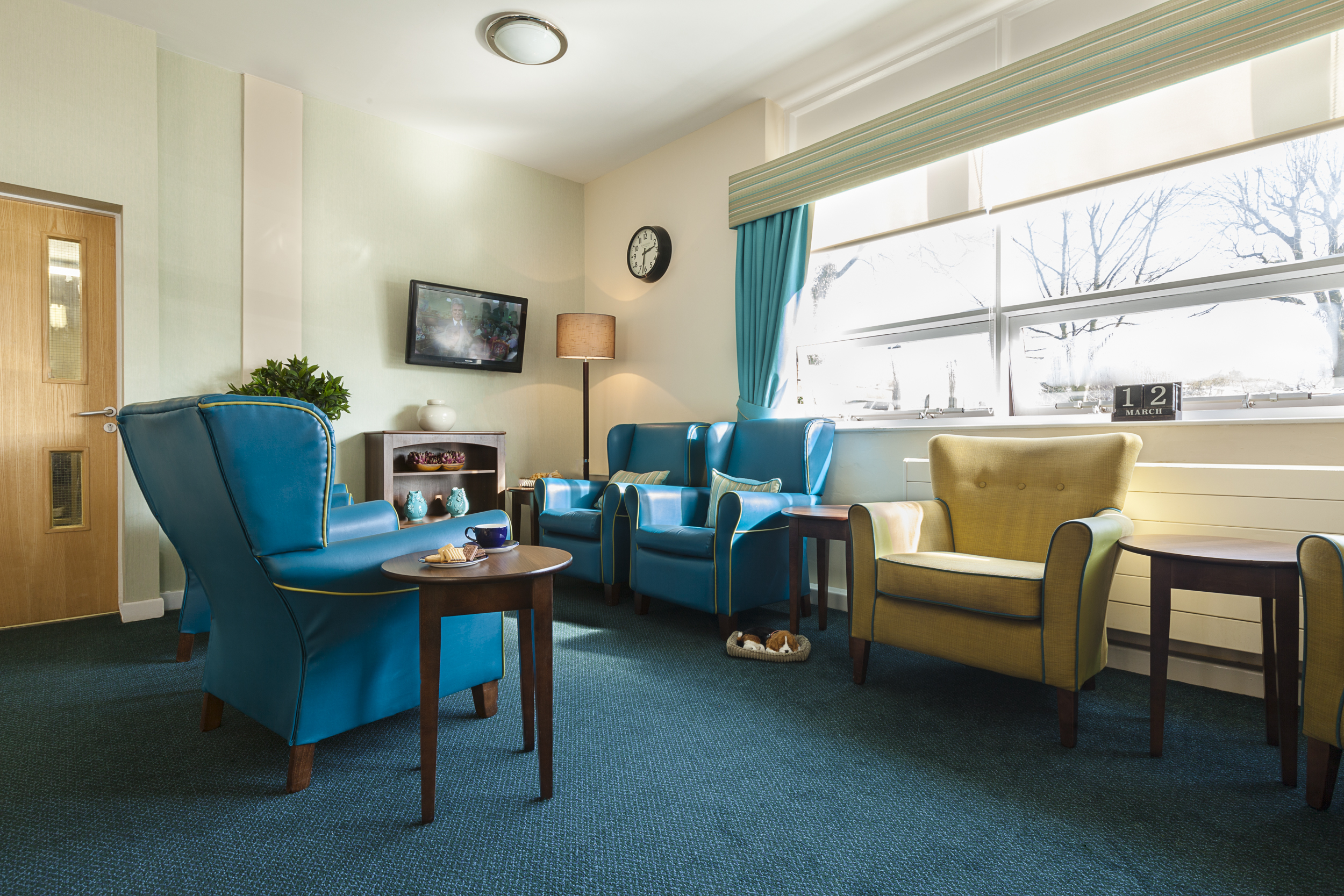green and blue chairs in a communal area